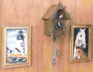 hand carved cuckoo-clock with paintings