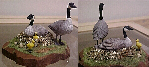 hand carved wood Canada goose family